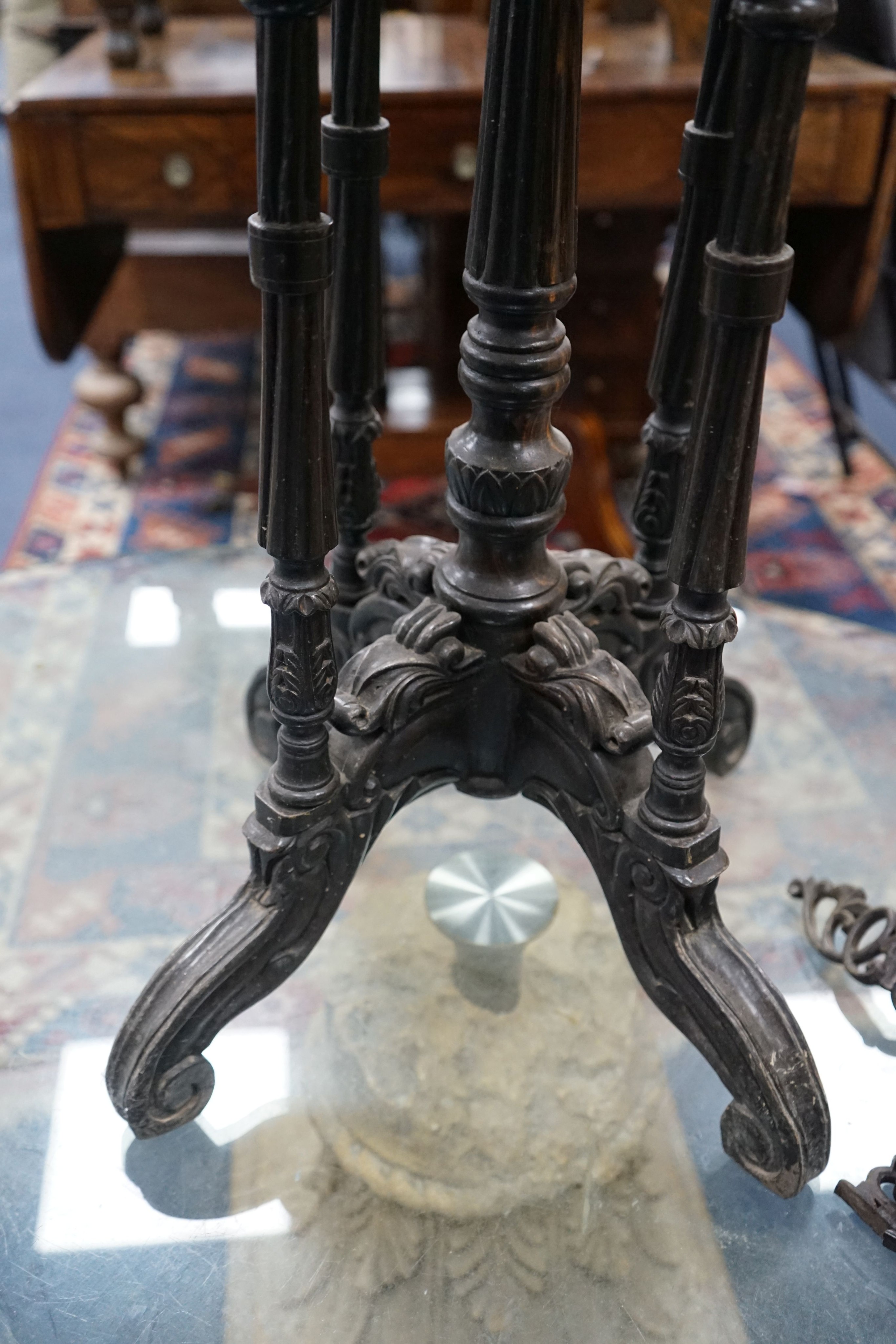 A 19th century Celanese carved ebony and coromandel veneered octagonal occasional table, width 57cm, depth 42cm, height 70cm